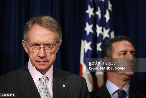 Washington, UNITED STATES: US Senate Majority Leader Harry Reid , D-NV, and Democratic Senator from Wisconsin Russ Feingold listen as Senator Barack...