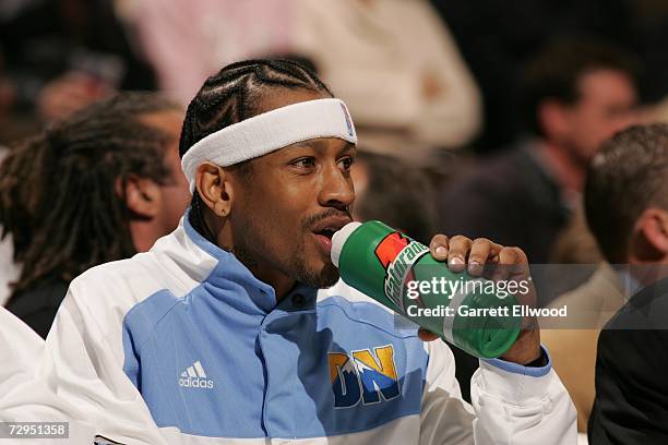 Allen Iverson of the Denver Nuggets drinks while sitting on the bench during the NBA game against the Sacramento Kings on December 22, 2006 at the...