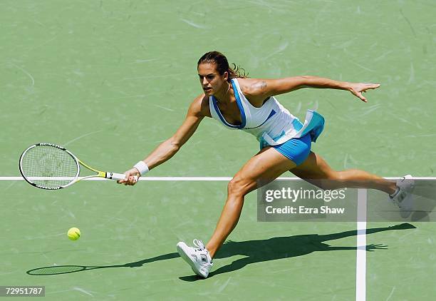 Amelie Mauresmo of France returns a shot to Tatiana Golovin of France during their match on day three of the 2007 Medibank International at the...