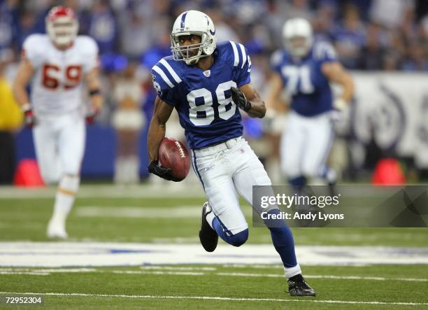 Marvin Harrison of the Indianapolis Colts runs for yards after the catch on a 42-yard reception in the first quarter against the Kansas City Chiefs...