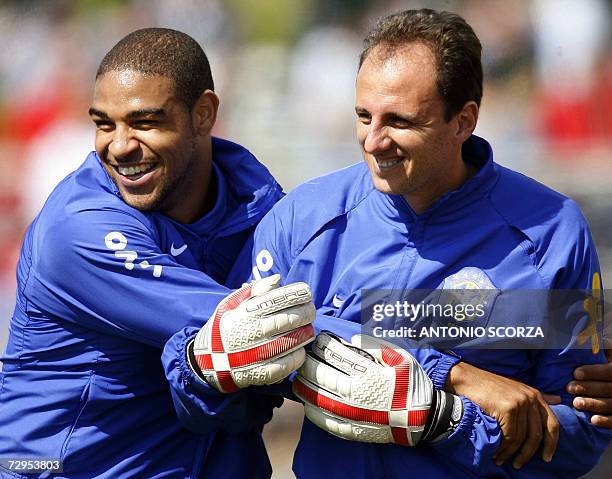 Brazilian striker Adriano holds goalkeeper Rogerio Ceni 07 June 2006 during a training session at the Zagallo Arena in Konigstein, Germany. Brazil's...