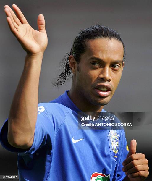 Brazilian striker Ronaldinho Gaucho waves to fans, 24 June 2006, during a training session at the Belkaw Arena in Bergish Gladbach, Germany ahead of...