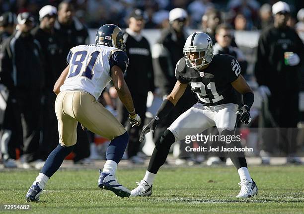 Nnamdi Asomugha of the Oakland Raiders guards Leonard Little of the St. Louis Rams at McAfee Coliseum December 17, 2006 in Oakland, California.