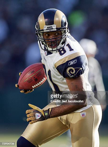 Torry Holt of the St. Louis Rams carries the ball during the game against the Oakland Raiders at McAfee Coliseum December 17, 2006 in Oakland,...