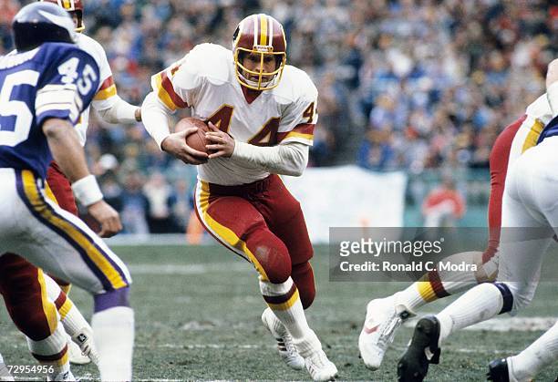 John Riggins of the Washington Redskins carries the ball during the NFC Divisional Playoff game against the Minnesota Vikings on January 15, l983 in...