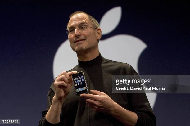 Apple CEO Steve Jobs holds up the new iPhone that was introduced at Macworld on January 9, 2007 in San Francisco, California. The new iPhone will...
