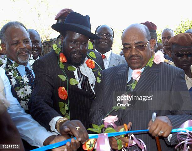 Sudanese President Omar al-Bashir and his southern deputy General Salva Kiir Mayardit , cut the ceremonial ribbon during the opening of Sudan Bank...