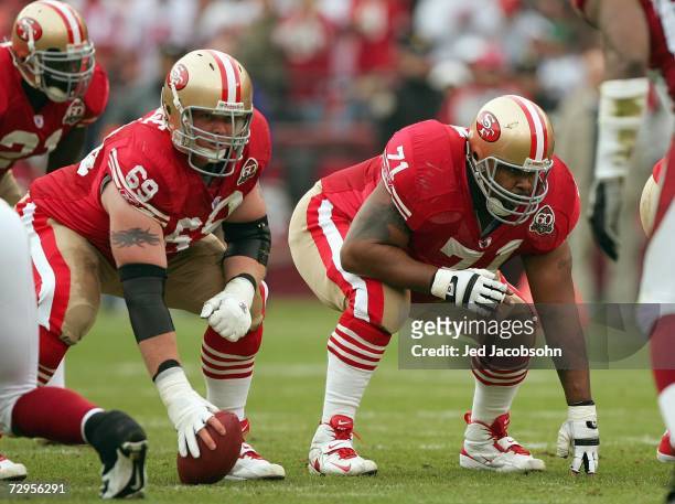 Tony Wragge and Larry Allen of the San Francisco 49ers get ready on the line of scrimmage during the game against the Arizona Cardinals at Monster...