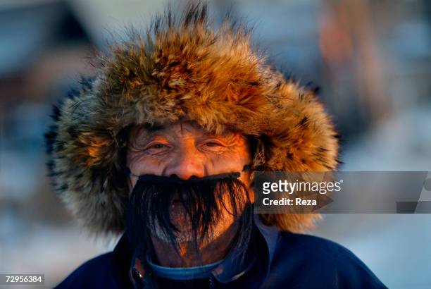 Man wears a fake moustache during the celebration of the Chinese New Year on February, 1999 in Heihe, China.