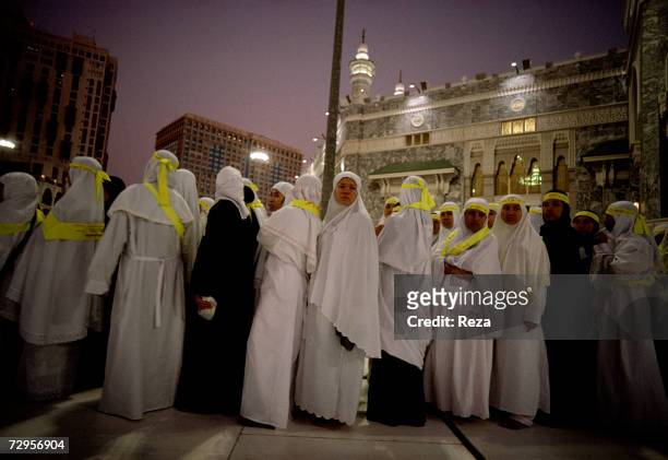 Female pilgrims queue up in front of the Masjid Al-Haram mosque during the hajj February, 2003 in Mecca, Saudi Arabia. Over five days of Hajj,...