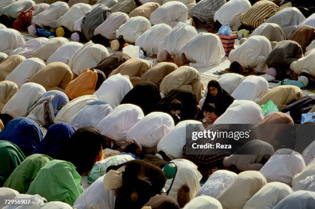 Worshippers pray around the Kaaba, Islam's most sacred sanctuary and pilgrimage shrine, in the Masjid al-Haram mosque February, 2003 in Mecca, Saudi...