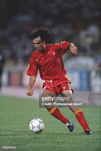 Belgian footballer Stephane Demol makes a run with the ball during the Round of 16 match between England and Belgium in the 1990 FIFA World Cup at...
