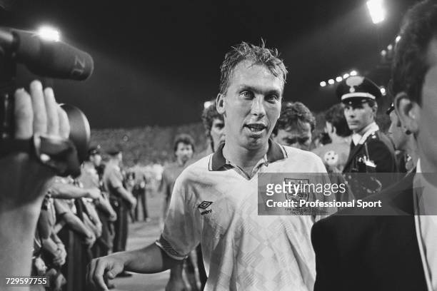 English footballer and goalscorer, David Platt pictured leaving the pitch at the end of the Group of 16 match between England and Belgium in the 1990...