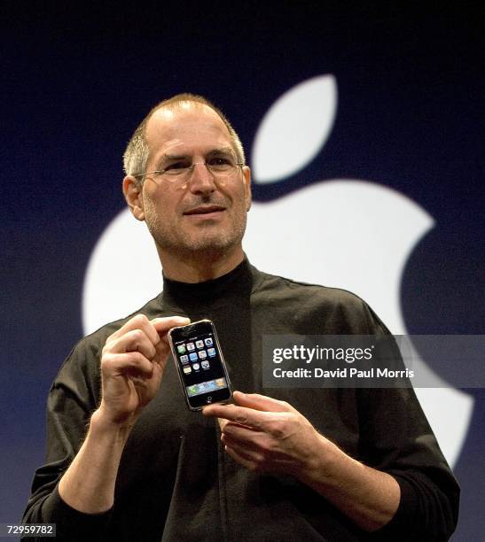 Apple CEO Steve Jobs holds up the new iPhone that was introduced at Macworld on January 9, 2007 in San Francisco, California. During the keynote Jobs...