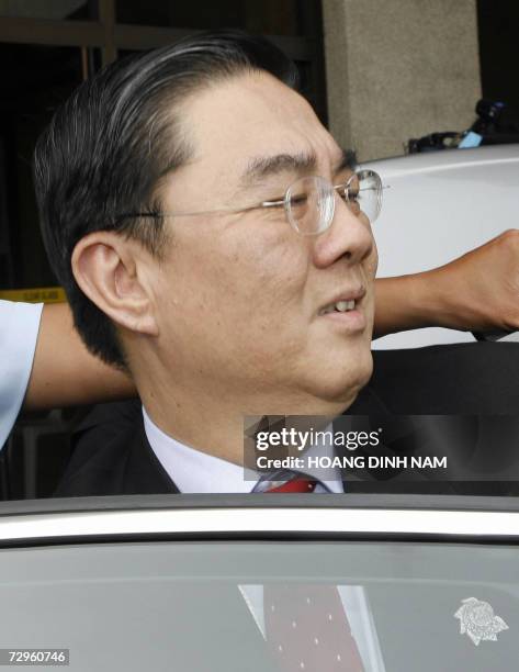 Association of Southeast Asian Nations secretary general Ong Keng Yong arrives waves to journalists from his limousine after arriving at the...