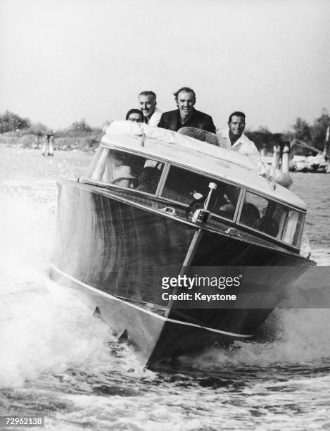 Scottish actor Sean Connery at the helm of a motorboat during the 28th Film Festival in Venice, 1967.