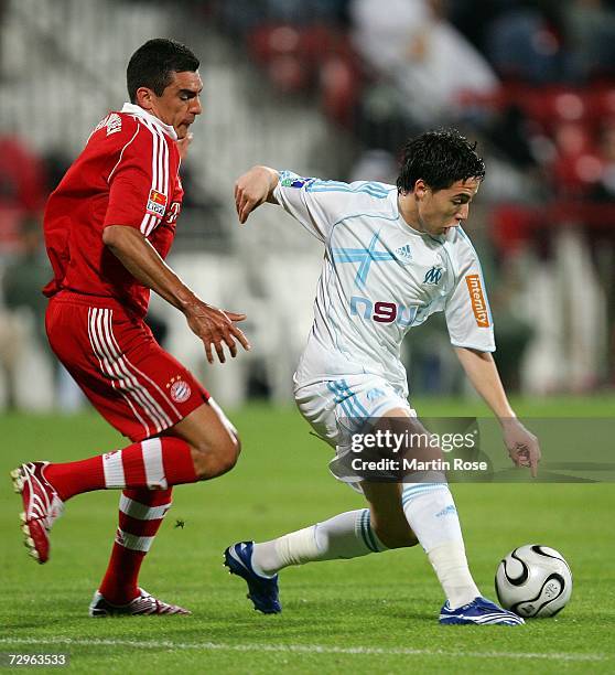 Samir Nasri of Marseille and Lucio of Munich fight for the ball during the 2007 Dubai Cup match between Bayern Munich and Olympique Marseille at the...