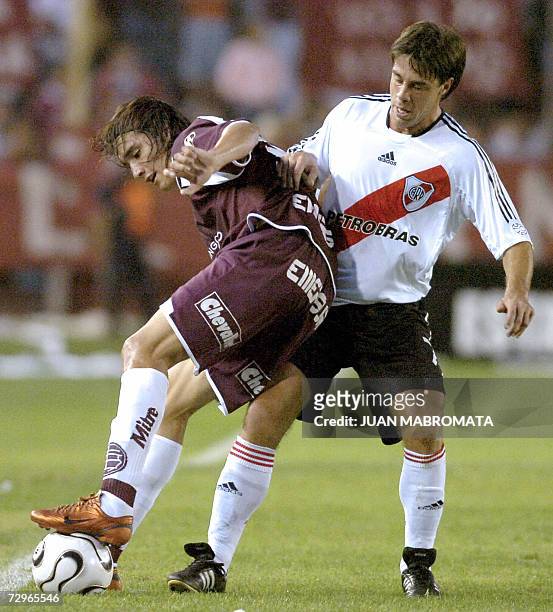 Buenos Aires, ARGENTINA: A file photo taken 02 April 2006 shows Lanus' Sebastian Leto vying for the ball with River Plate's Lucas Pusineri during...