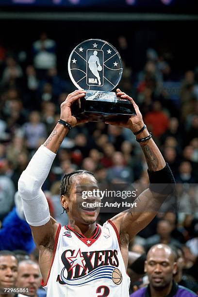 Allen Iverson of the Philadelphia 76ers displays his league MVP trophy before a 2001 NBA Game played at the First Union Center in Philadelphia,...