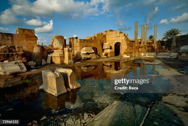 Water reflects the ruins of the Basilica, part of the Roman ruins of Leptis Magna, the largest city of the ancient region of Tripolitania, May 2000...