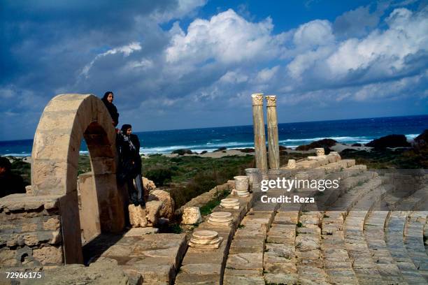 An ocean view is seen from the top of the tiered seating area for the theater ruins of Leptis Magna, the largest city of the ancient region of...