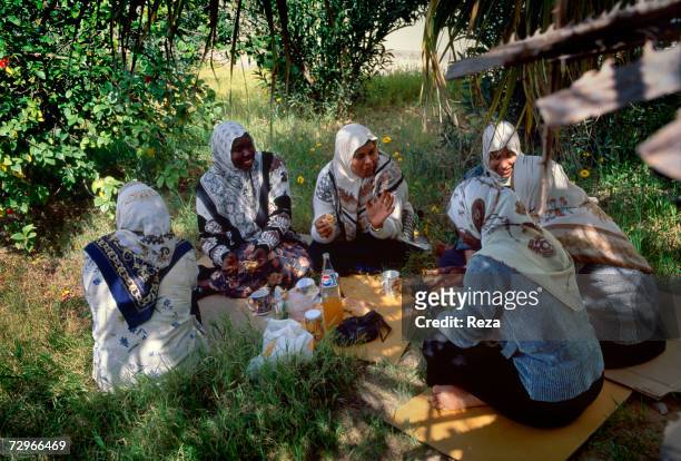 Women factory workers have a picnic on March, 2000 in Tripoli, Libya.