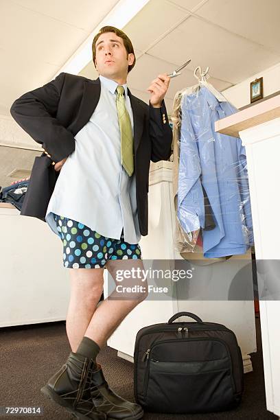 businessman waiting for his pants at a drycleaners - pants down bildbanksfoton och bilder