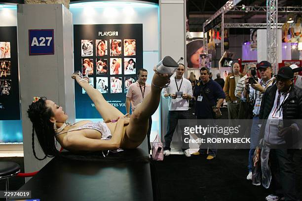 Las Vegas, UNITED STATES: Ange Venus and Layla pose for attendees at the maxhardcore.com booth during the AVN Adult Entertainment Expo in Las Vegas,...