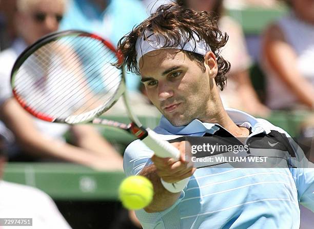 Roger Federer hits a forehand return against Russian Marat Safin at the Kooyong Classic, in Melbourne 11 January 2007. Federer won 6-3, 7-6 . Eight...