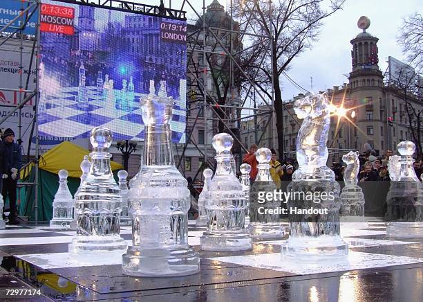 In this handout image supplied by Freud Communications, Giant chess pieces carved from ice in Trafalgar Square form part of a live chess game between...