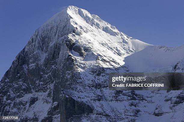 The notorious Swiss mountain, the Eiger with its "Nordwand" one of the six great north faces of the Alps catches the sunlight 11 January 2007 in...