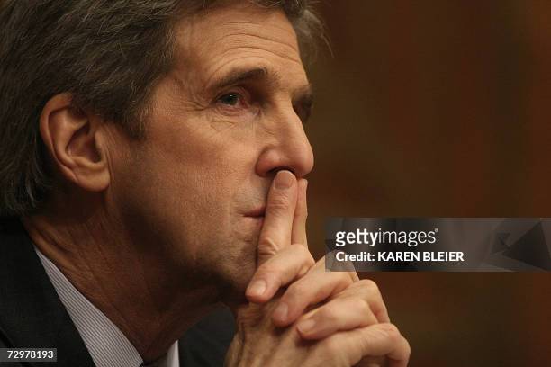 Washington, UNITED STATES: US Sen. John Kerry, D-MA listens to testimony given by US Secretary of State Condoleezza Rice during US Senate Foreign...