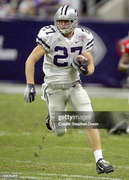 Jordy Nelson of the Kansas State Wildcats carries the ball during the Texas Bowl against the Rutgers Scarlet Knights on December 28, 2006 at Reliant...