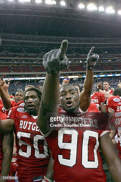 Defensive end Jamaal Westerman of the Rutgers Scarlet Knights celebrates with teammates after the game against the Kansas State Wildcats in the Texas...