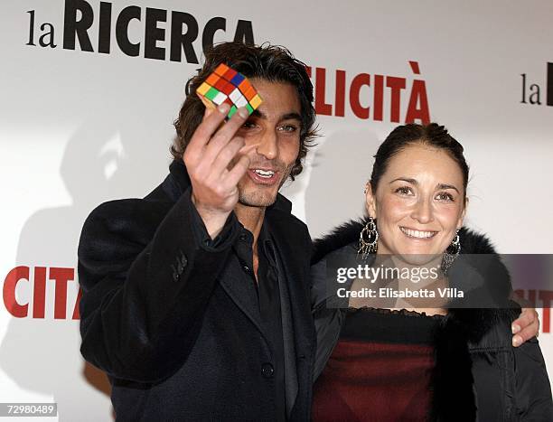 Italian actor Daniele Liotti and an unidentified companion attends the premiere of ''Pursuit Of Happyness'' at the Auditorium Conciliazione on...