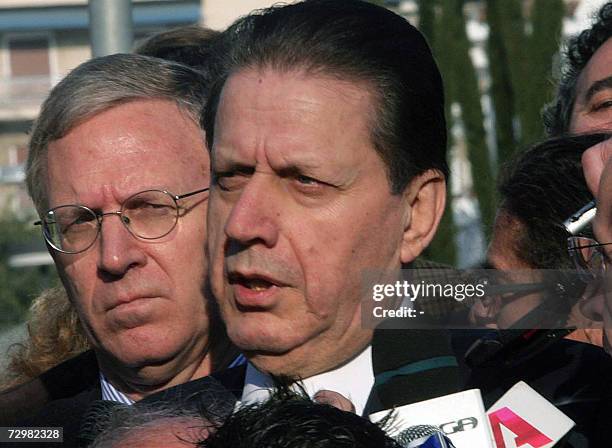 Greek Public Order Minister Vyronas Polydoras and the US ambassador to Greece, Charles Ries , speak to journalists outside the US Embassy in Athens...