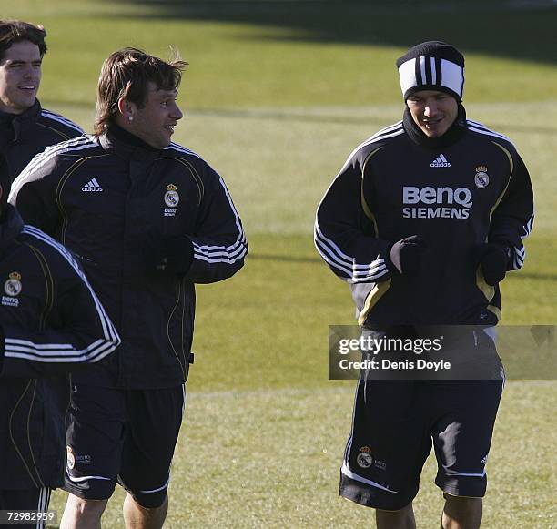 David Beckham chats with teammate Antonio Cassano during a Real Madrid training session at the club's Veldebebas training ground on January 12 in...