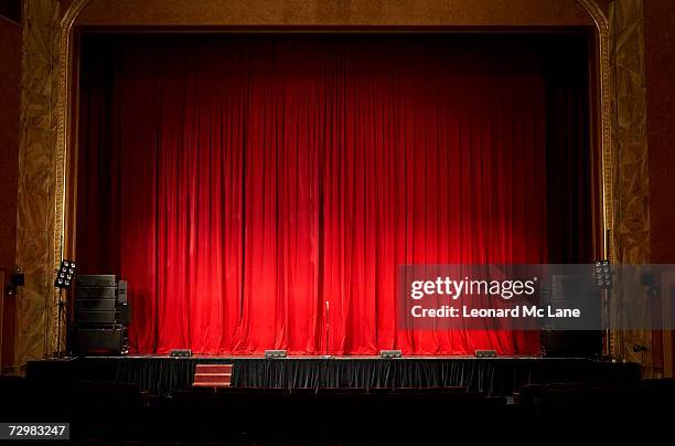 illuminated empty theatre stage - stage with red curtain stock pictures, royalty-free photos & images