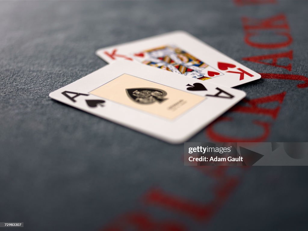 Playing cards on Blackjack table in casino, close-up