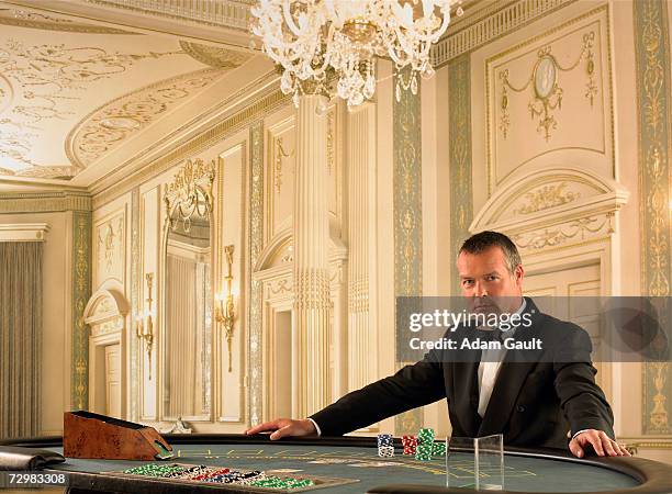 male croupier at blackjack table in casino, portrait - blackjack bildbanksfoton och bilder
