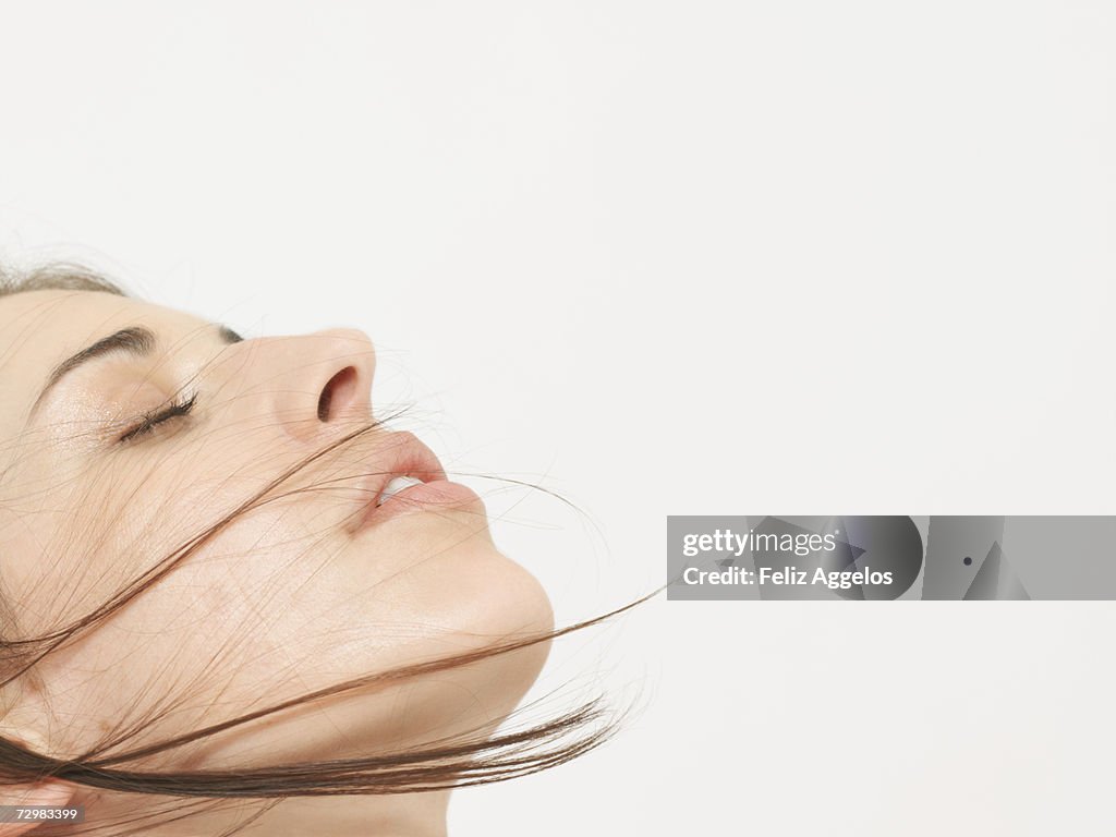 Young woman with eyes closed