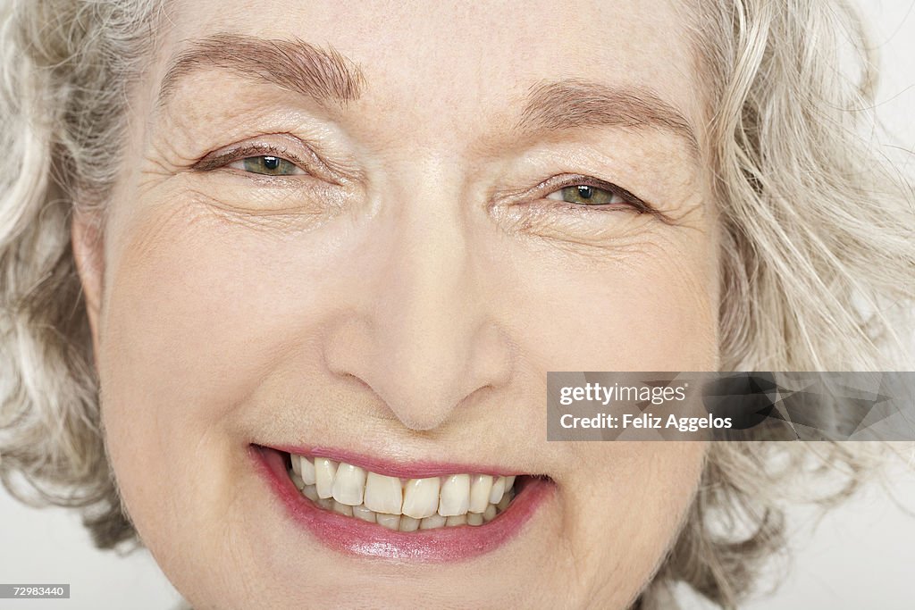 Senior woman, smiling, close-up, portrait