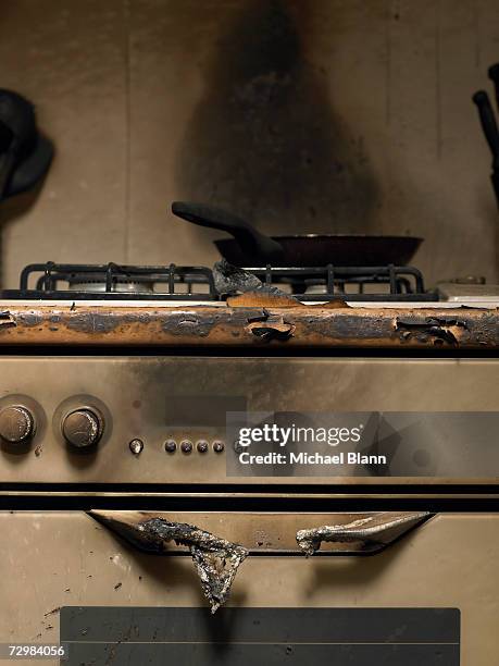 frying pan on smoke stained cooker in kitchen after fire - dirty pan stock pictures, royalty-free photos & images