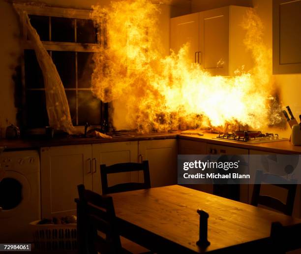 fire raging in domestic kitchen at night - eldsvåda bildbanksfoton och bilder