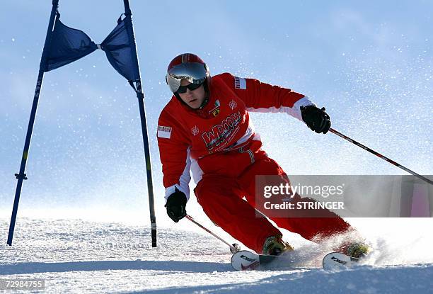 Ferrari Formula One driver Finland's Kimi Raikkonen clears a gate during a giant slalom race as part of the "WROOOM F1 press meeting", the yearly...