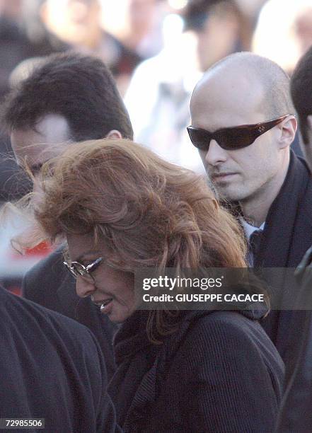 Italian actress Sophia Loren and his son Eduardo arrive at the funeral of Italian producer Carlo Ponti at the San Martin, 12 January 2007 in Magenta,...