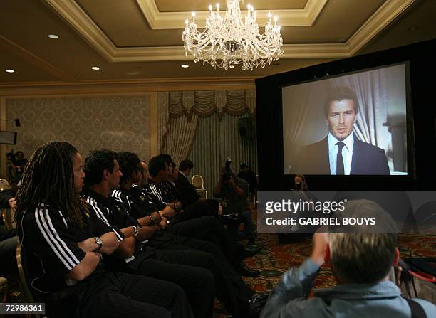 Marina del Rey, UNITED STATES: Los Angeles Galaxy soccer players listen to British soccer star David Beckham during a press conference, live via...