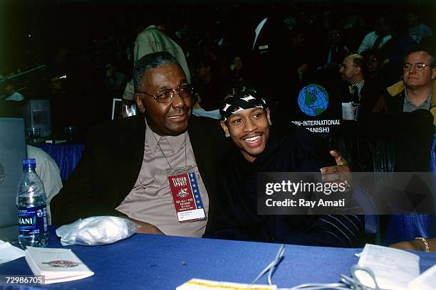 Allen Iverson of the Philadelphia 76ers poses with former Georgetown University coach John Thompson before the 2001 NBA All-Star Game played February...