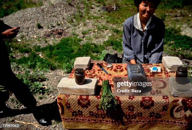 Woman sells caviar to passers-by in Amur Delta's region, near Komsomolsk October 1999 in Russian Federation.