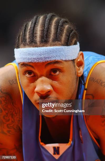 Carmello Anthony of the Denver Nuggets stands on the court during the NBA game against the Atlanta Hawks at Philips Arena on December 12, 2006 in...